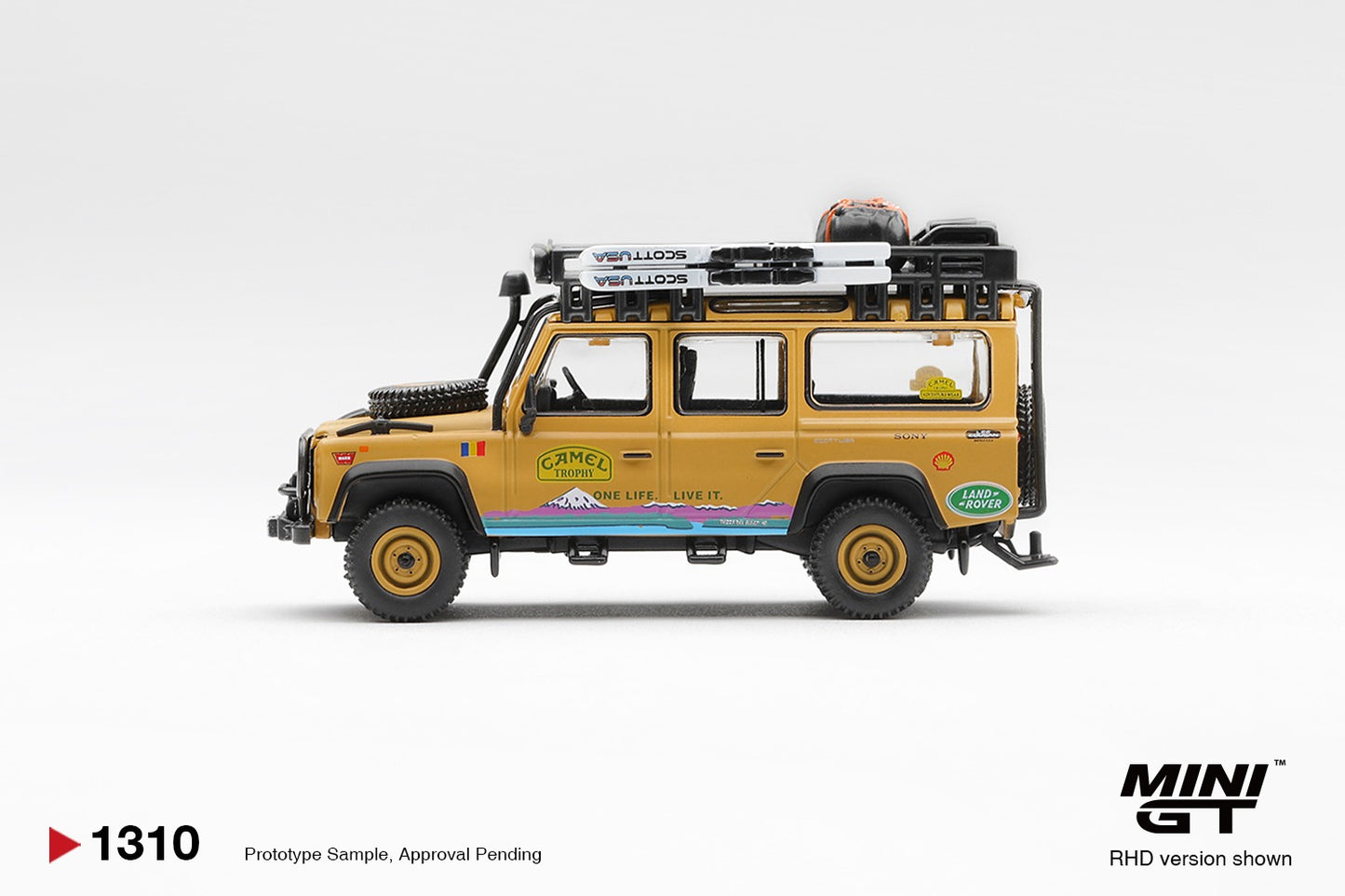 * PRE ORDER * MINI GT #1310 1/64 Land Rover Defender 110 1998 Camel Trophy Tierra del Fuego CT.36 Romania (RHD)