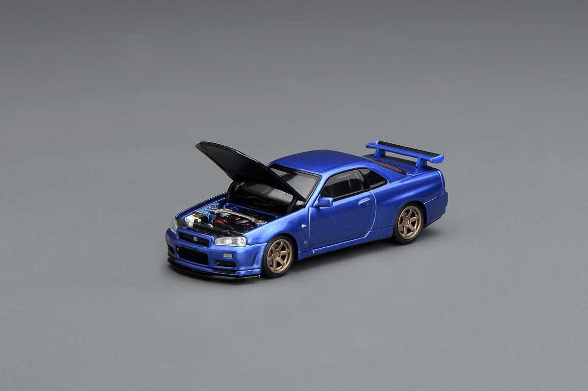 MOTORHELIX 1:64 NISSAN SKYLINE GT-R (R34) V-SPEC II CUSTOMIZED BAYSIDE BLUE W/ CARBON FIBER BONNET M63450
