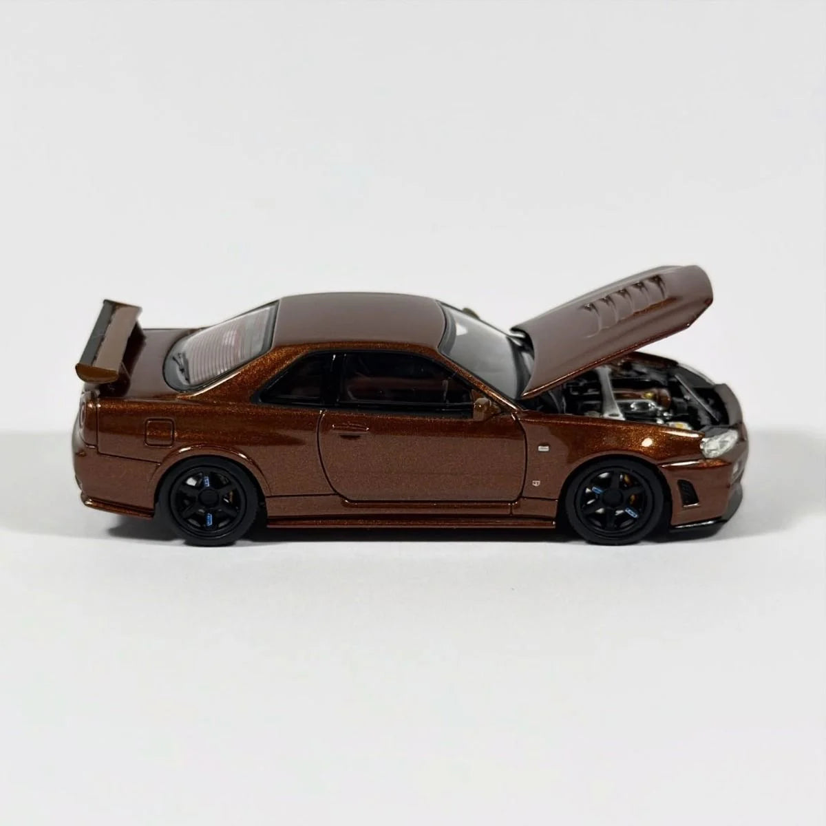 MOTORHELIX 1/64 Nissan Skyline GT-R R34 Nismo Customized Metallic Bronze M63466 - CHINA TOY EXPO