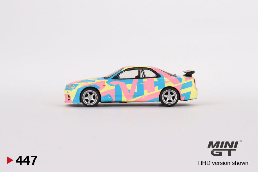 MINI GT #447 1/64 Nissan Skyline GT-R (R34)V-Spec ll MINI GT Digital Camouflage Yellow (RHD)
