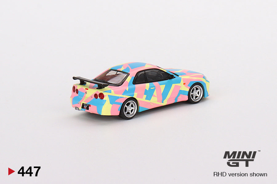 MINI GT #447 1/64 Nissan Skyline GT-R (R34)V-Spec ll MINI GT Digital Camouflage Yellow (RHD)