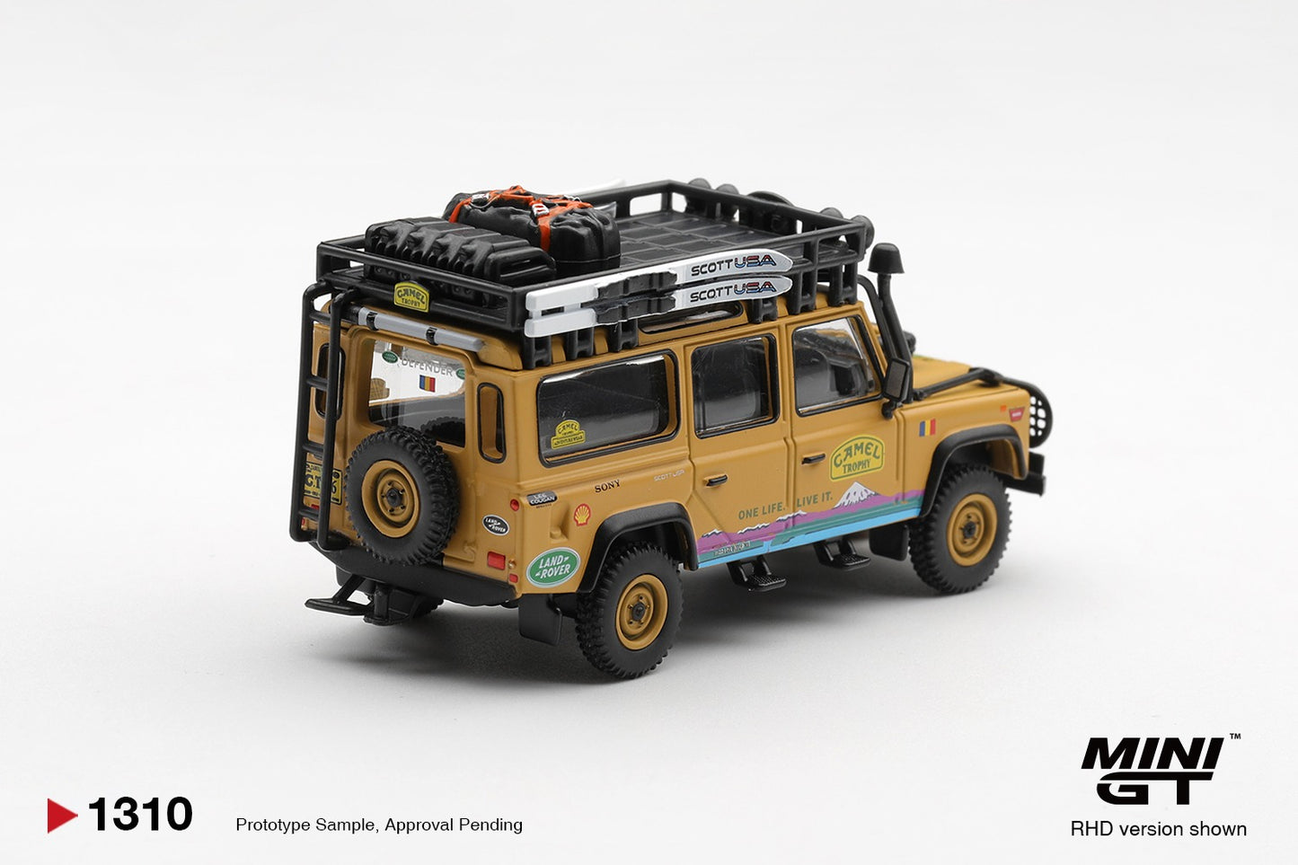 * PRE ORDER * MINI GT #1310 1/64 Land Rover Defender 110 1998 Camel Trophy Tierra del Fuego CT.36 Romania (RHD)