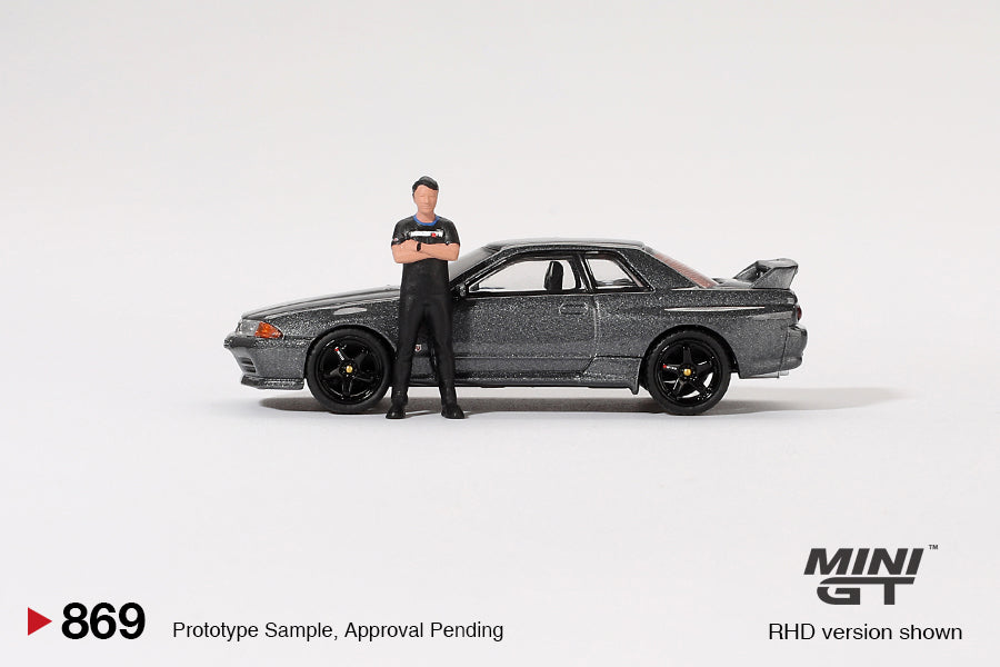 MINI GT #869 1/64 Nissan Skyline GT-R (R32) Gunmetal W/ Matsuda Figure Tsugio Matsuda Collection