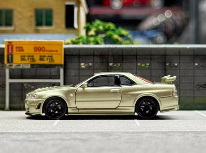 Motorhelix 1/64 NISSAN SKYLINE GT-R R34 V SPEC II  E - MILLENNIUM JADE M63405